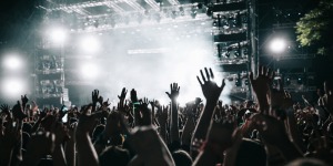 A busy crowd facing a concert stage