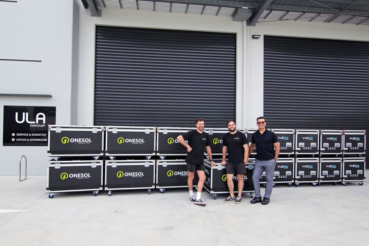 Onesol Staff and ULA Group Director, featured with the newly purchased AR P3 Panels in customised flight cases